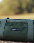 Zoomed in image of utility tool bag with words "adventure better" embroidered on the back side of bag
