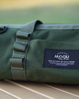 Zoomed in image of the Mogu outdoors quality black embroidered label design