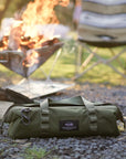 Durable high quality camp utility toolbag with heavy duty water resistant Cordura material with carabiner at campsite with campfire and camp chair with boho pattern.
